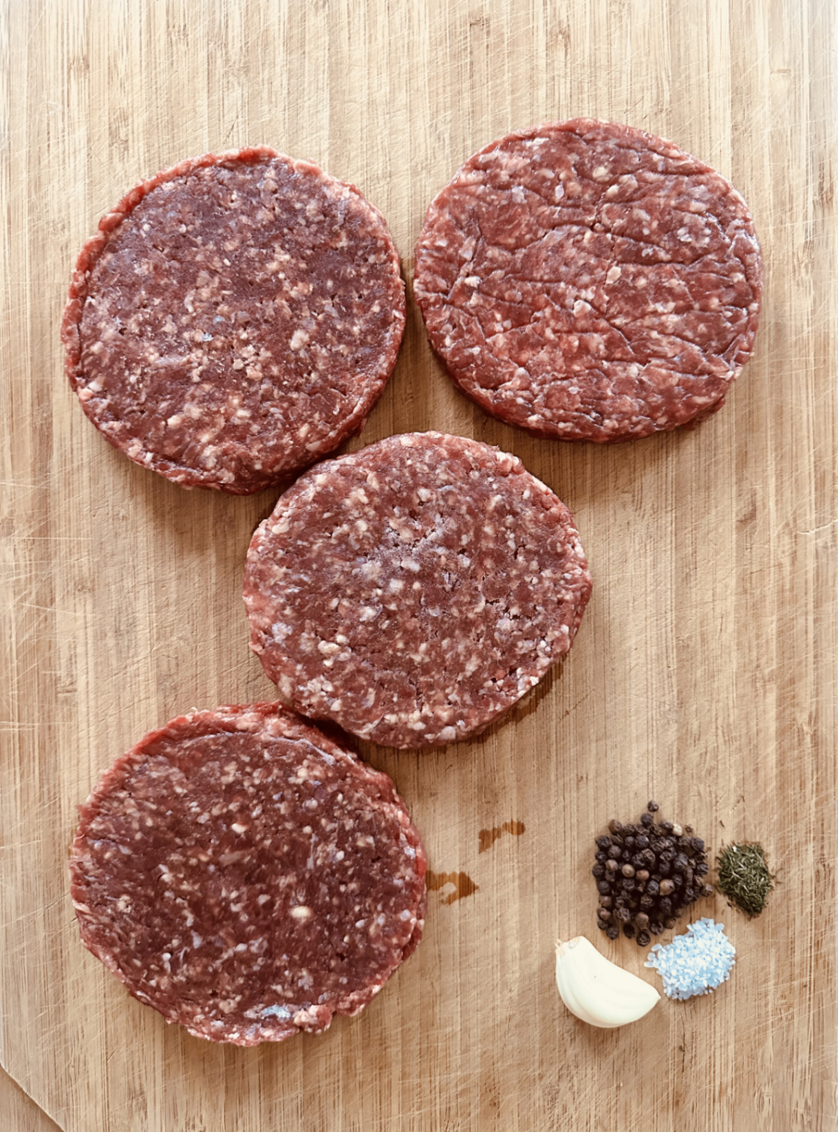 Handmade ground beef patties with seasonings